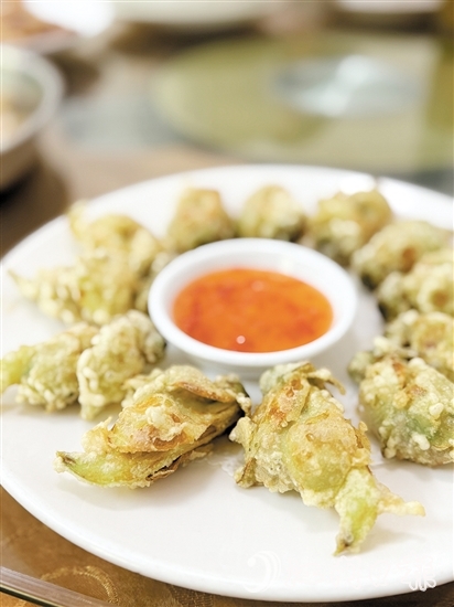 梁記山莊推出的應季菜式“炸禾雀花”。